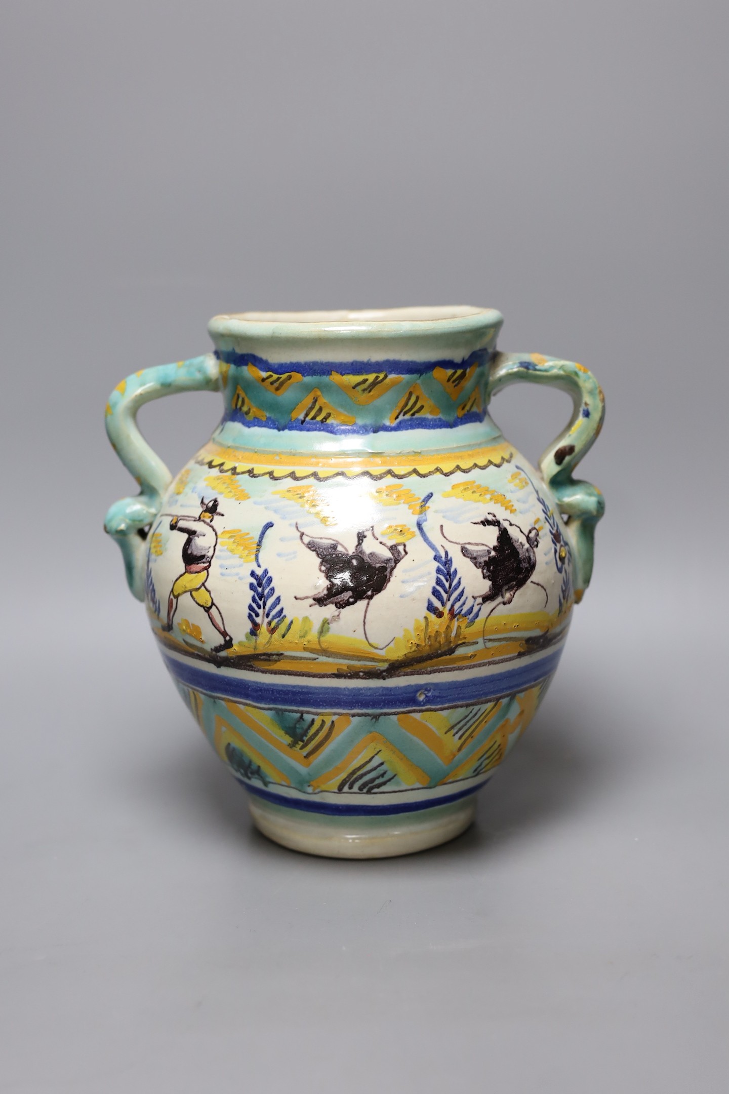 A maiolica vase decorated with hares, 23cm tall